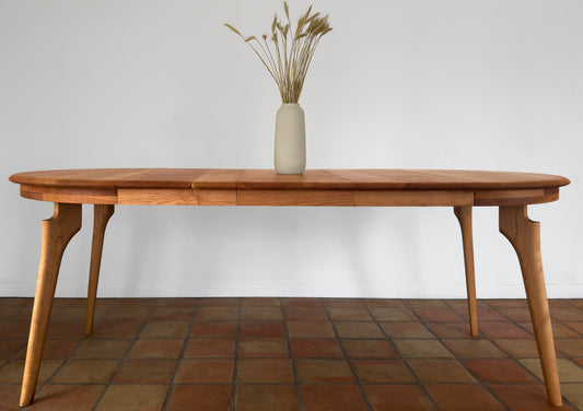 Round Dining Table with Extensions: A Meditation on Material Culture and Domestic Philosophy